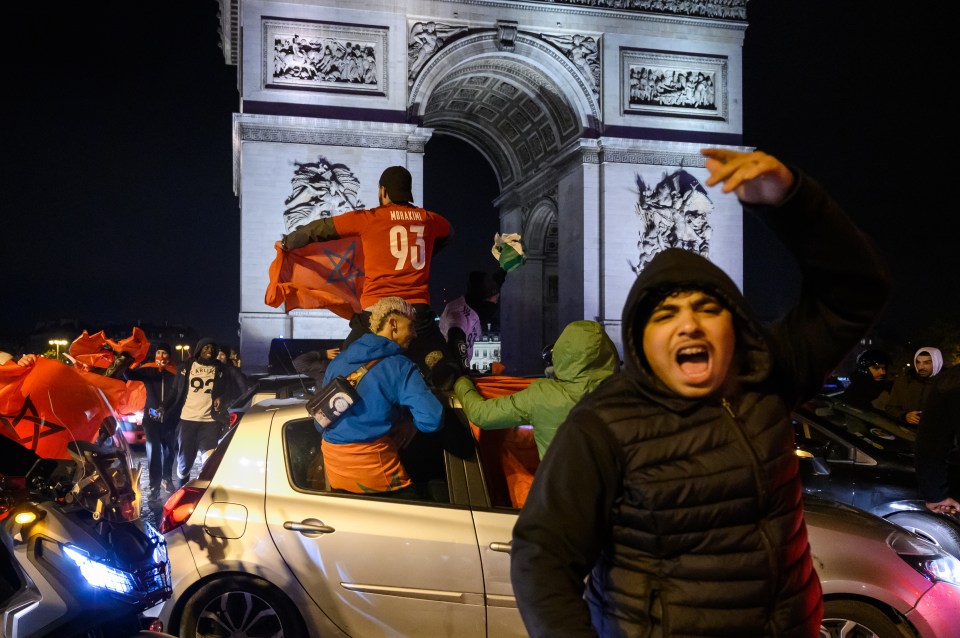 Moroccan fans celebrating in Champs-Elysees after the national team shocked Portugal in the World Cup quarter-finals