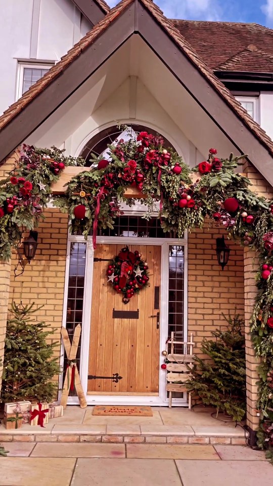 The mum-of-two took to social media yesterday to show off her new festive front door display, which is packed full of Christmas tree branches, baubles, twinkling lights and beautiful red ribbon