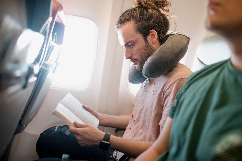 Travel pillows can make long-haul flights much easier - if you wear them right