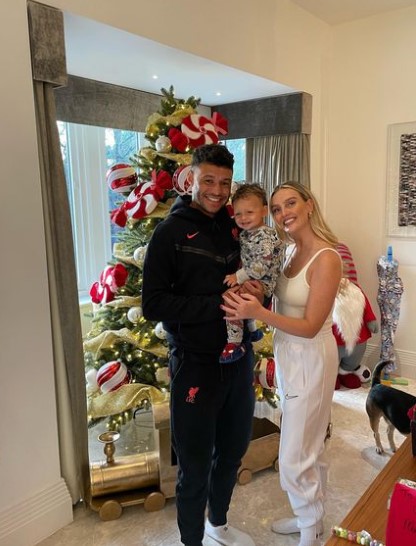 Perrie, Alex and Axel looked delighted as they celebrated Christmas