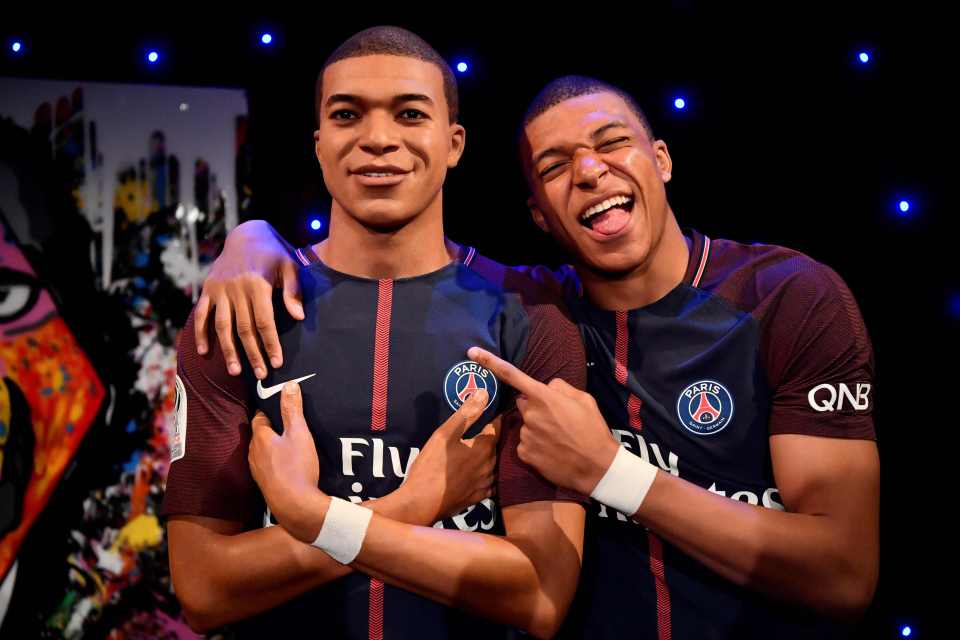 Mbappe with his waxwork likeness at the Grevin Museum in Paris