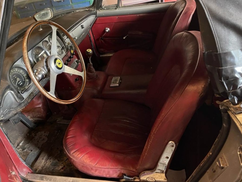 Its original red leather interior is still intact and all its panels are all original too