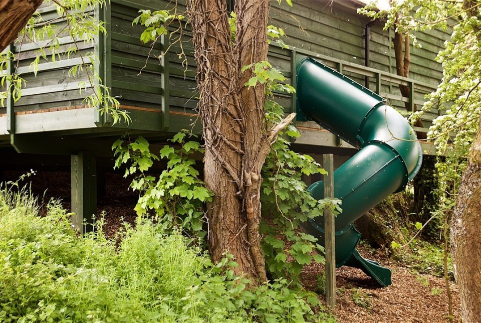 Kids will be bowled over by the slide that winds from the bedroom to the garden