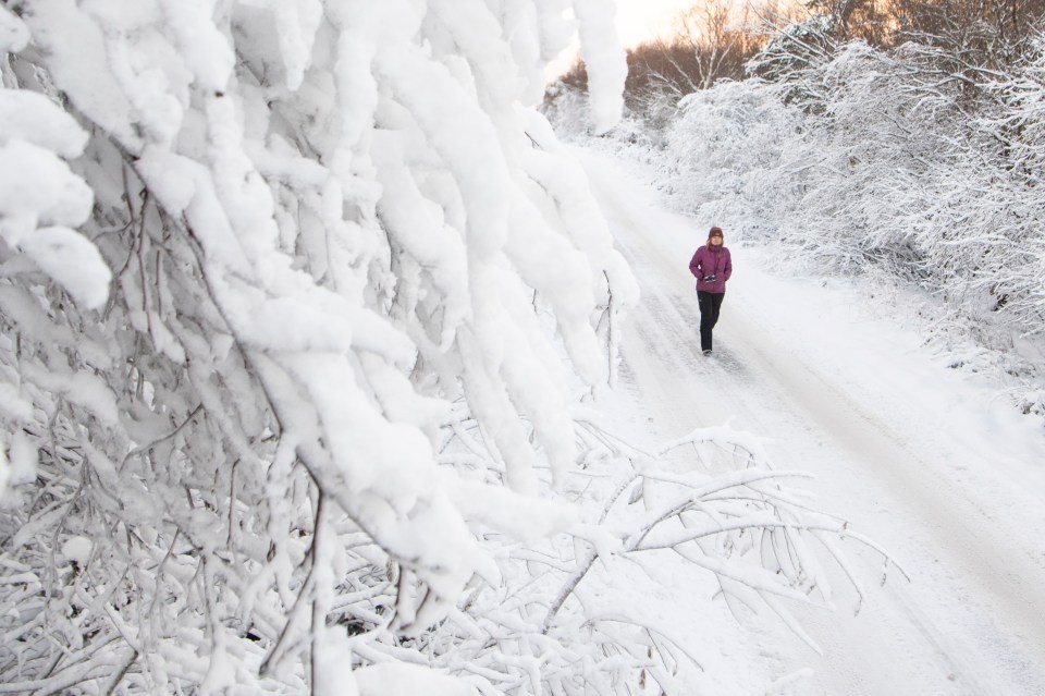 A jogger tackles an icy path in Ugthorpe, North Yorkshire, as more snow is expected in the coming days