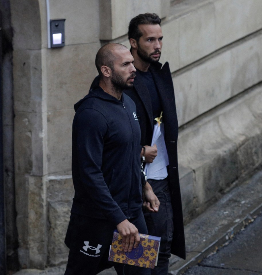 Andrew Tate and his brother Tristan are escorted by police officers