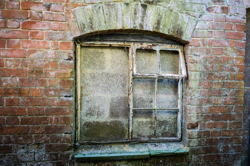 Houses are boarded up in the ghost town