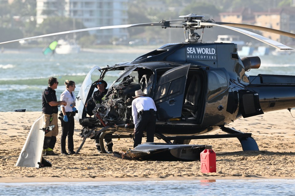 Officials inspecting the other chopper, which had its front wrecked