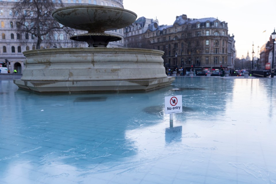 The top of the water of the fountain in London's Trafalgar Square frozen