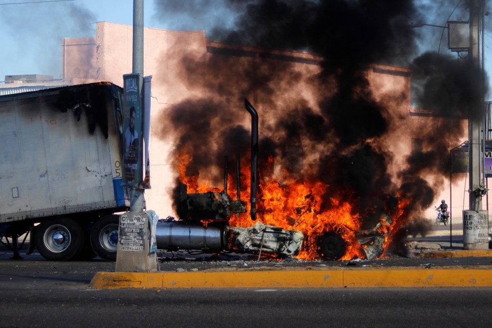 A truck burns on a street in Culiacan after an attack by the cartel