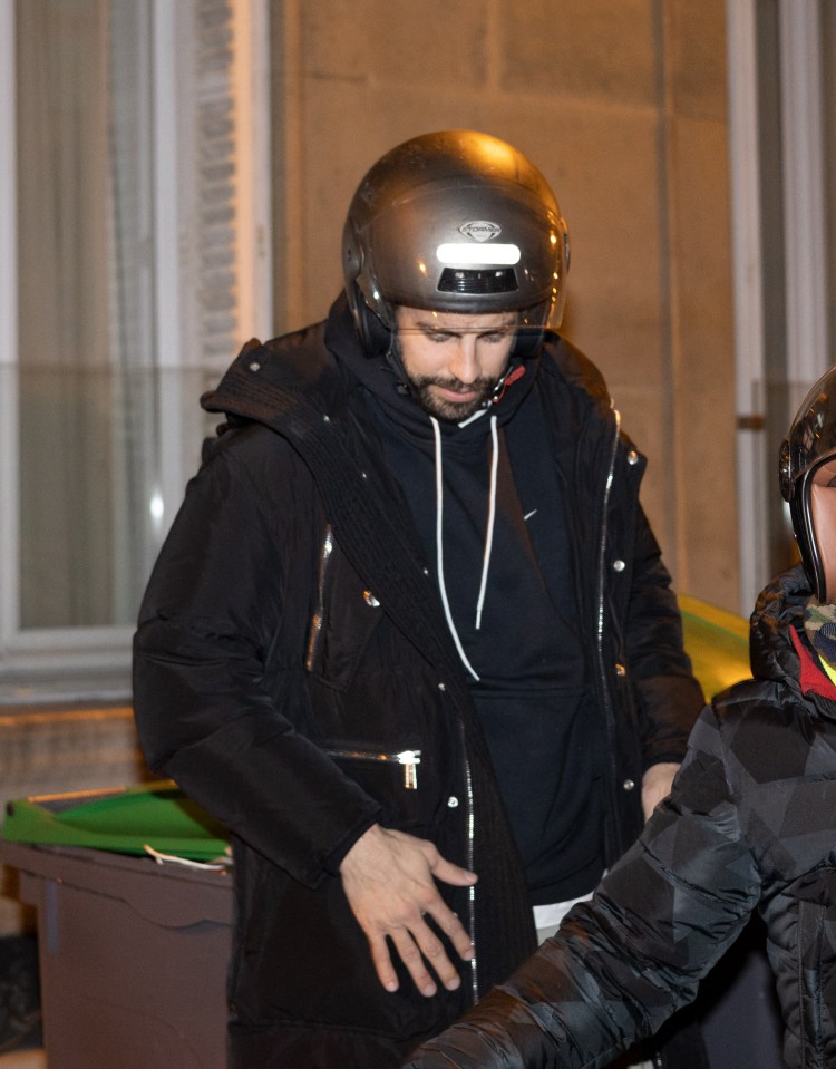 Pique donned a helmet for his motorcycle ride home on the brisk evening