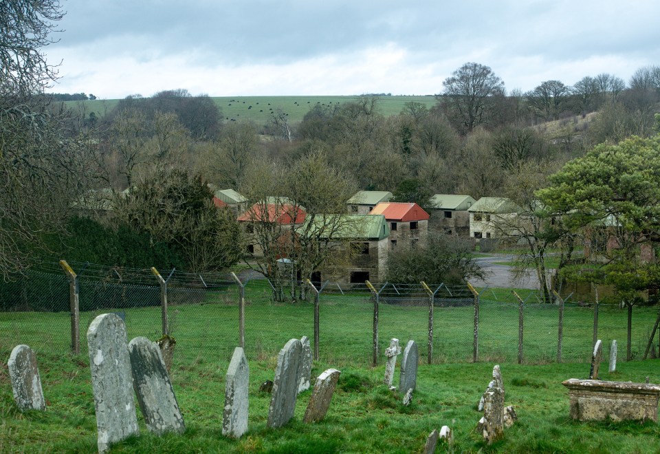 Abandoned houses stand in a once thriving village that now sits empty