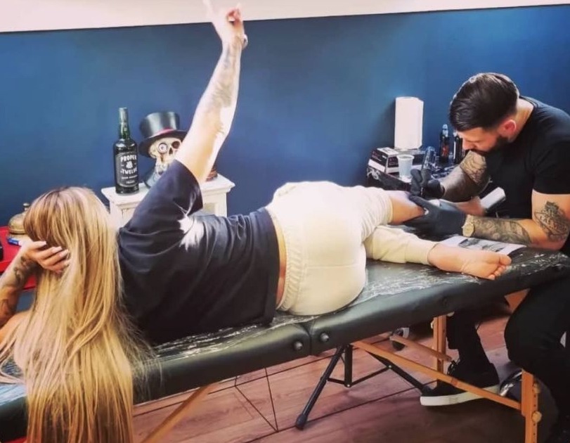 Katie Price has teased a huge new tattoo after a seven-hour appointment