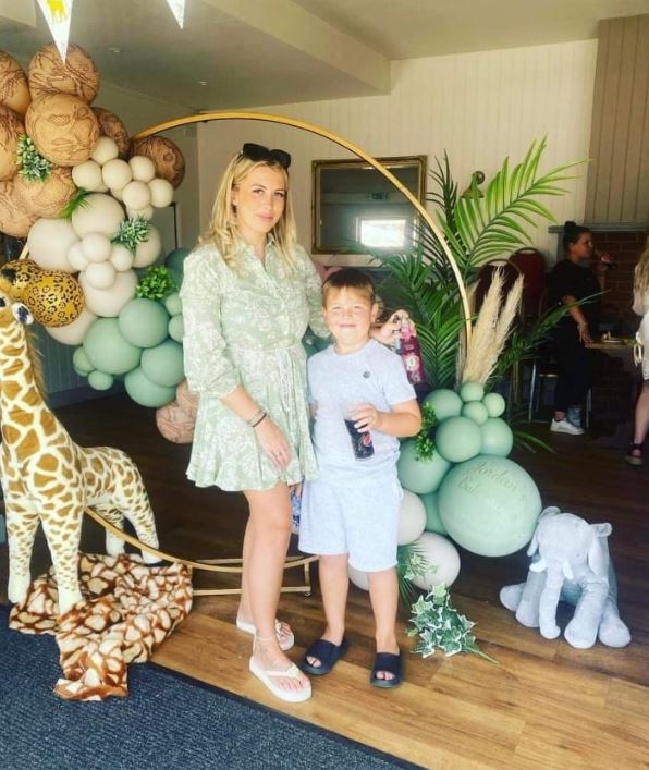 Ace, pictured with his mum Amber, was rushed to hospital while on holiday in Barbados