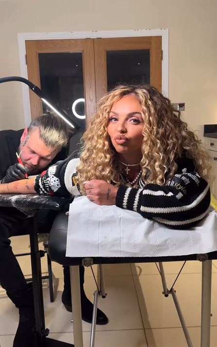 Jesy was seen getting a tattoo in a new video