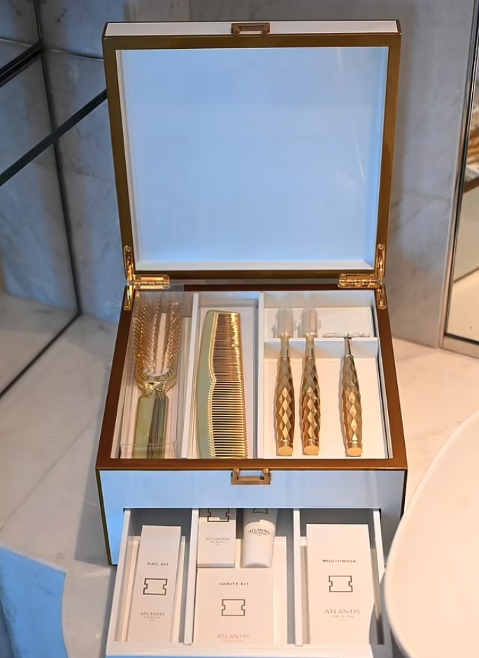 Gold pleated toothbrushes, combs and razors await guests at The Royal