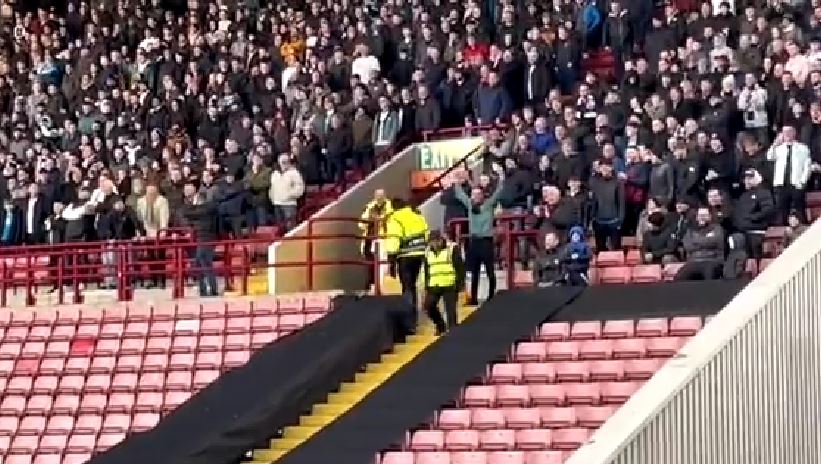 The Bolton fan celebrated after getting the Barnsley fan's number