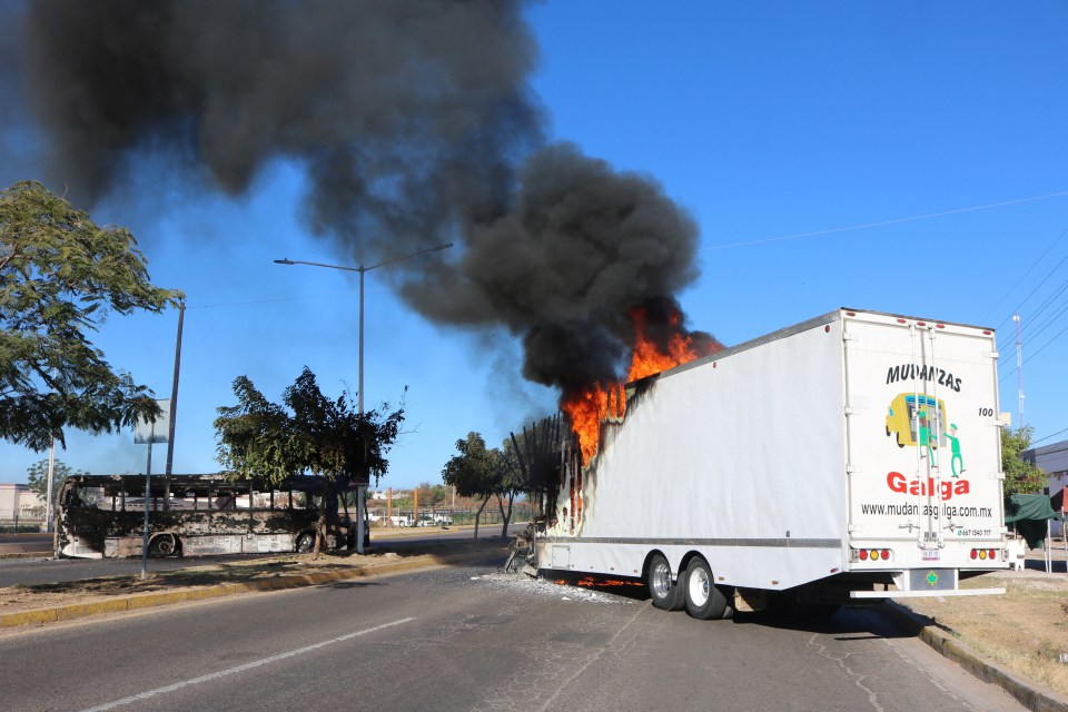 Cartel fighters have torched vehicles and set up roadblocks