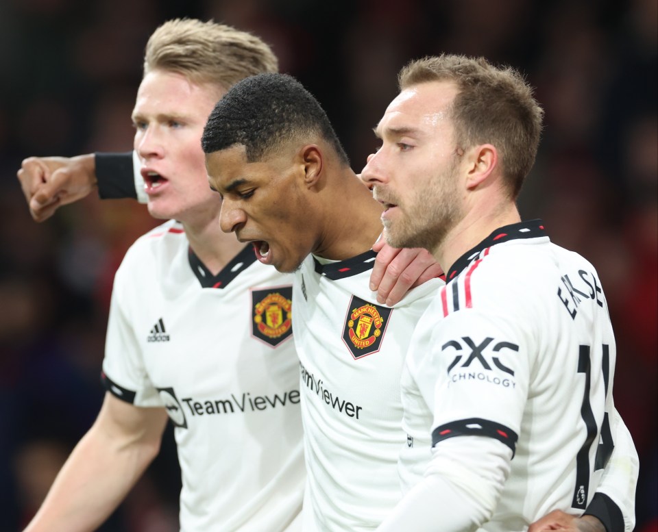 Scott McTominay and Christian Eriksen congratulate Rashford