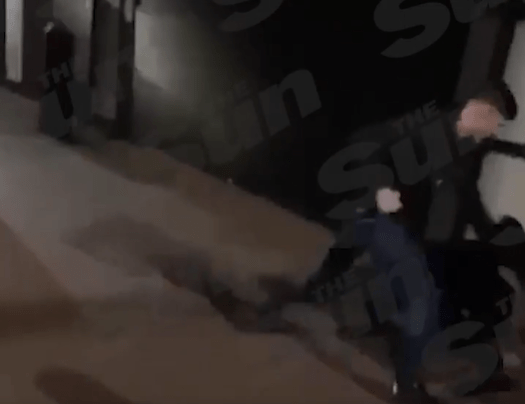 Haris is seen to punch the man for a second time in the video as he falls to the ground