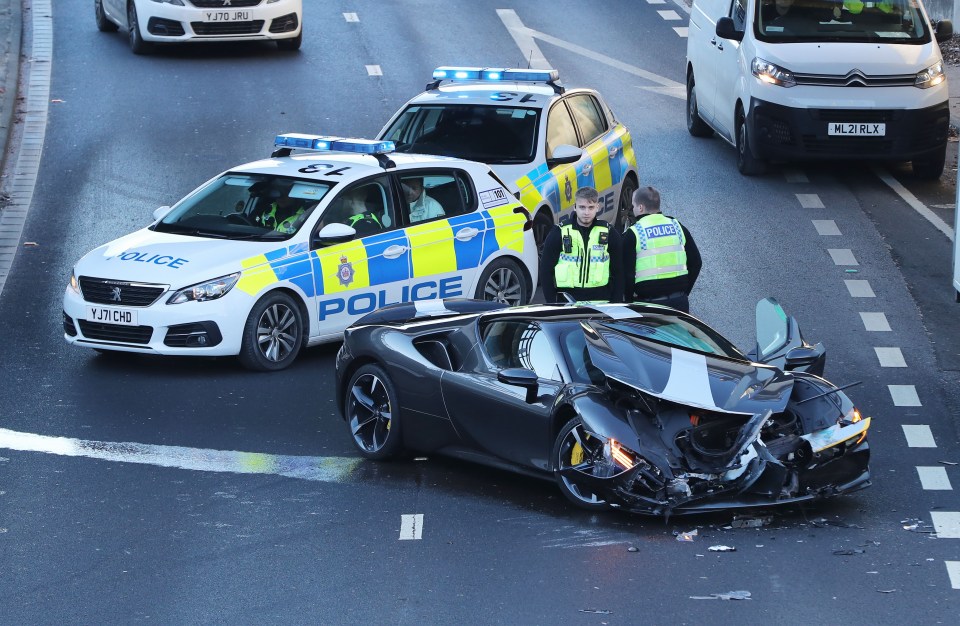 The £500,000 Ferrari was mangled after careering over the dual carriageway's central reservation