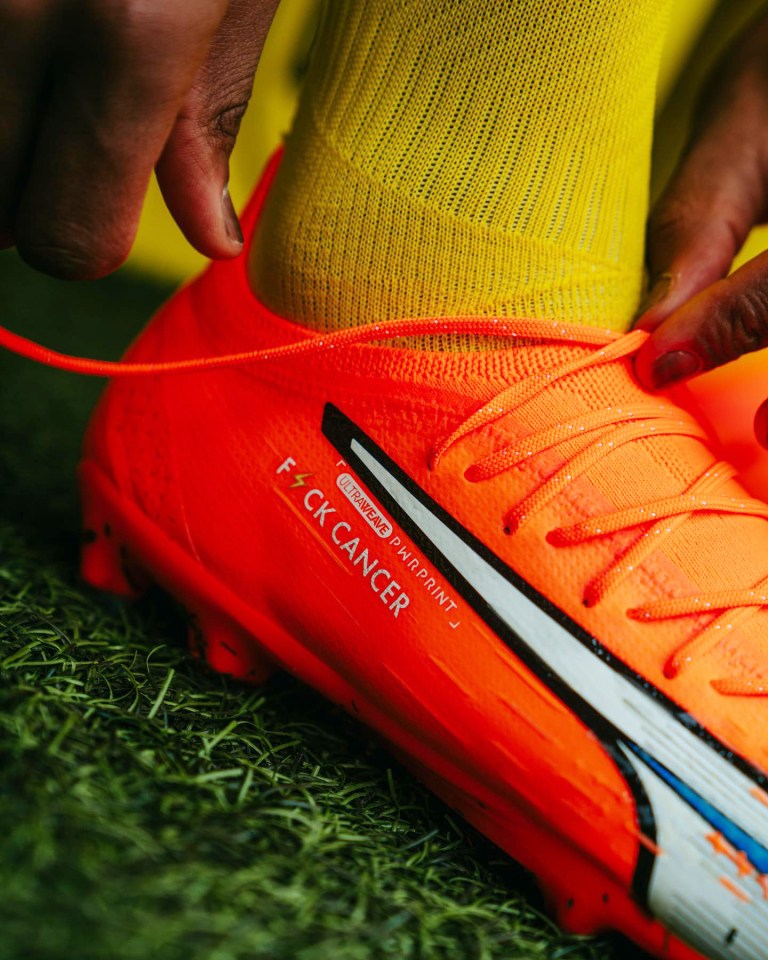 The striker will be wearing his customised orange Puma boots