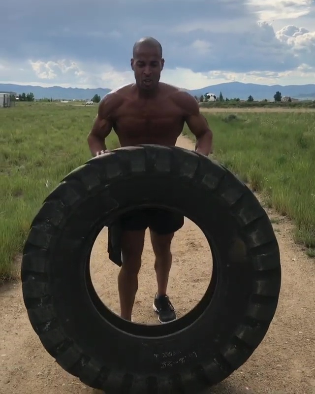 A massive truck tire is no match for super-toned David