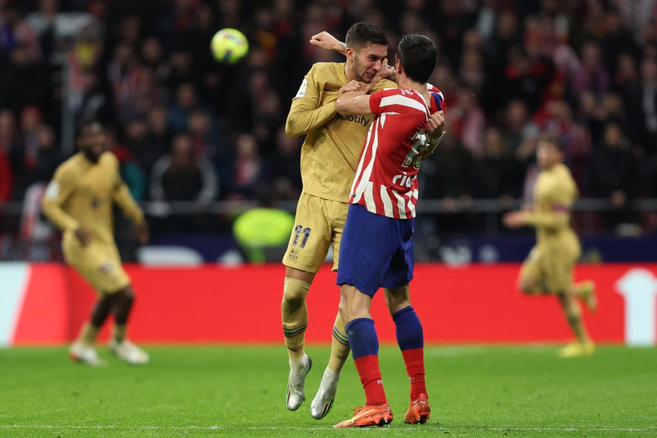 The duo tussled in stoppage time of Atletico's clash with Barcelona