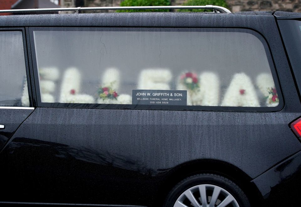 Flowers spelt out Elle's name as she was laid to rest