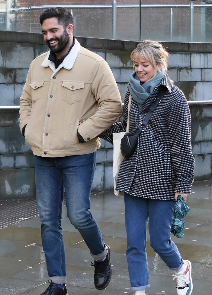 Georgia, 42, and Charlie, 33, beamed as they strolled arm-in-arm in Manchester on Thursday