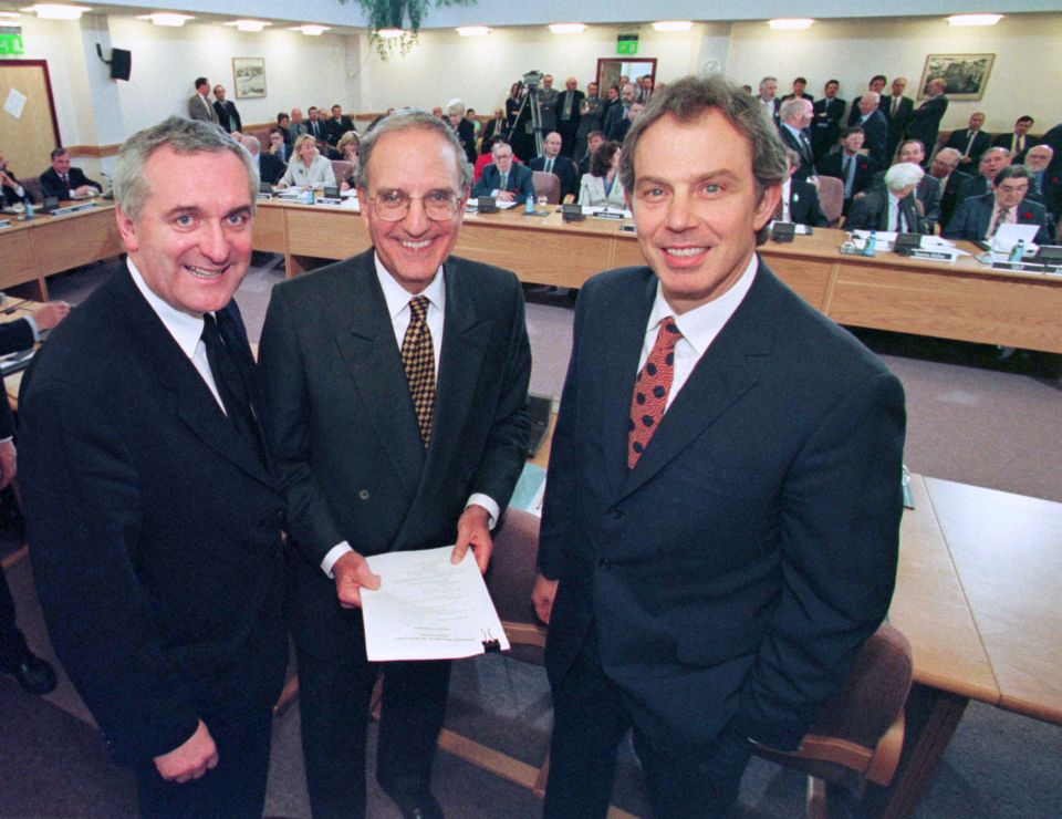 Irish PM Bertie Ahern, left, US Senator George Mitchell and Tony Blair after signing the peace deal in 1998