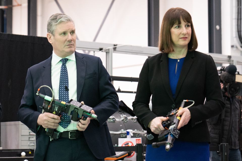 Sir Keir Starmer and Shadow Chancellor Rachel Reeves hold drills used for aeroplane wing assembly