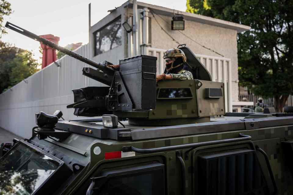 An armoured vehicle patrols after the arrest of El Chapo's son