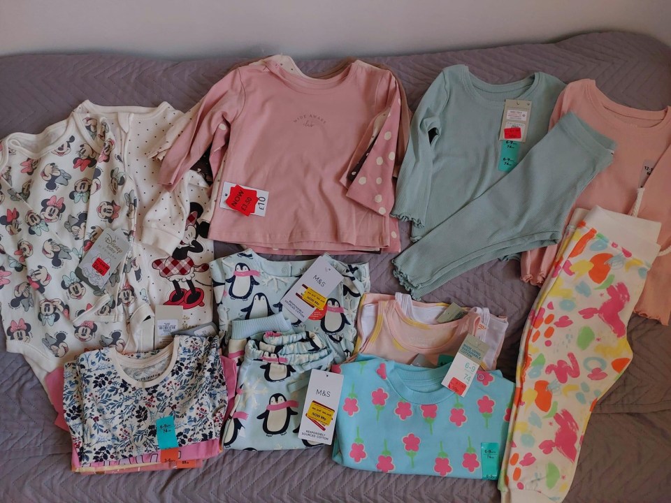 The mum showed off the giant haul of clothing she got for her kids