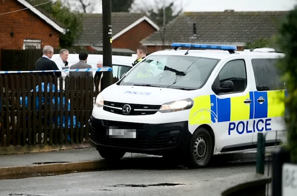 Cops at the scene of the alleged murder in Wisbech, Cambs