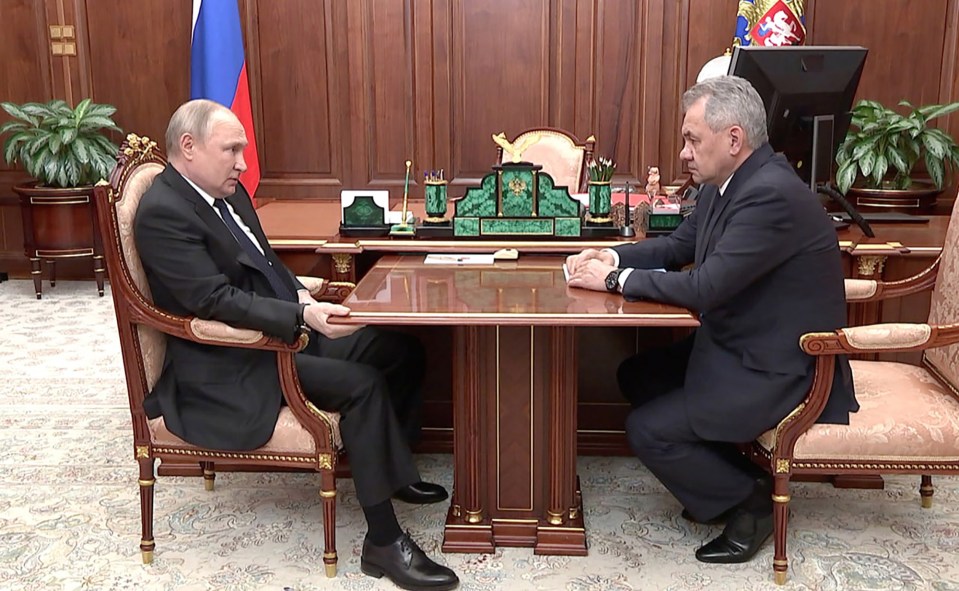 Grimacing Putin was seen gripping the table in a meeting last year with defence minister Sergei Shoigu