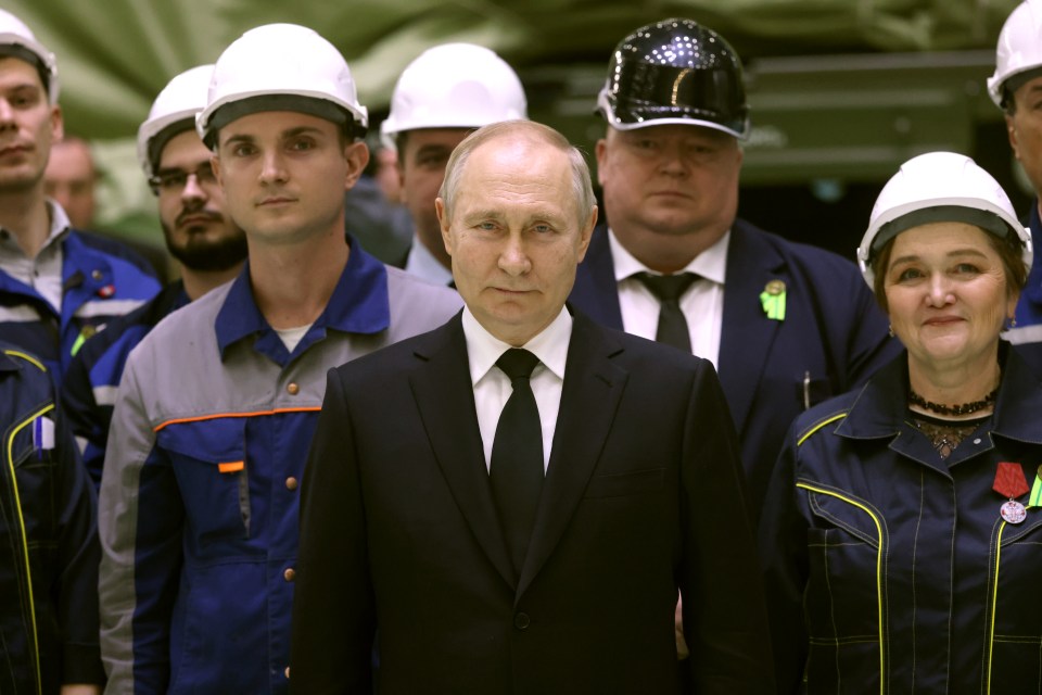 Putin meets with workers at a steel plant in St Petersburg on Wednesday