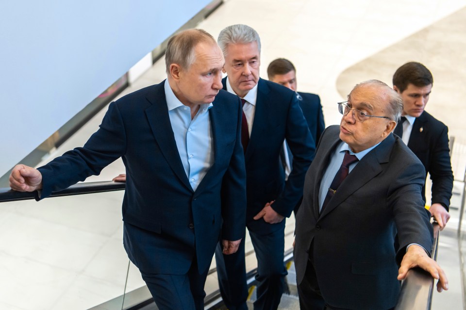 Putin pictured touring the Lomonosov Moscow State University on Wednesday