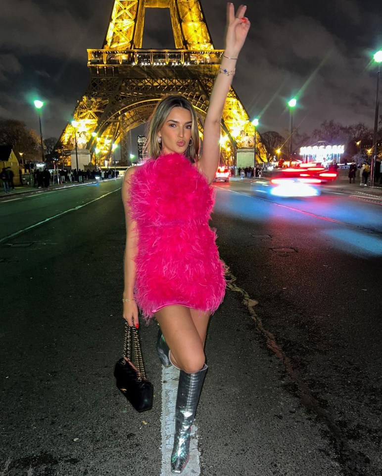 Sasha Attwood pictured in hot-pink feathers and silver boots in Paris