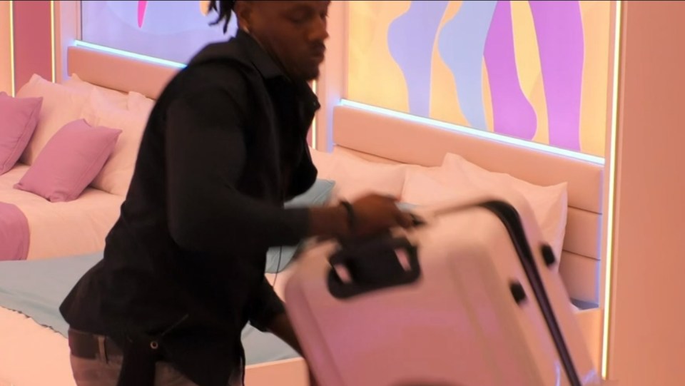 Shaq from Love Island packing David's bags for him