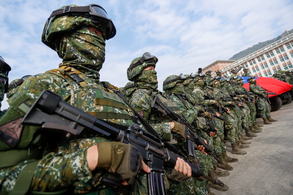 Taiwanese soldiers stand guard during drills amid tensions with China