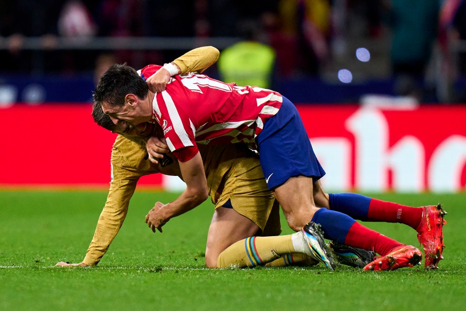 Stefan Savic and Ferran Torres wrestle each other