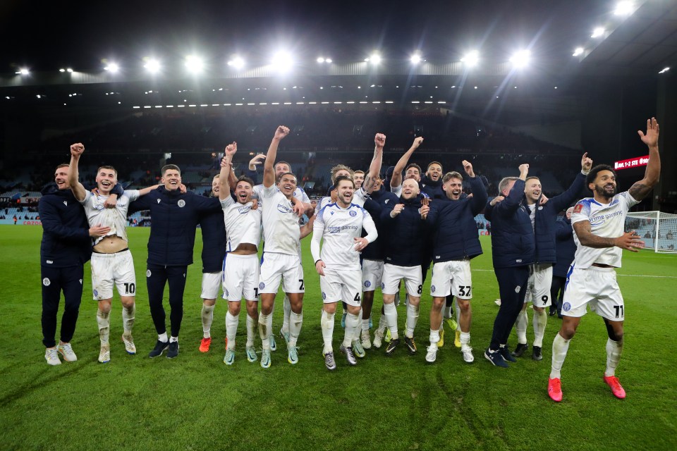 Stevenage celebrate on the Villa Park pitch after their famous win