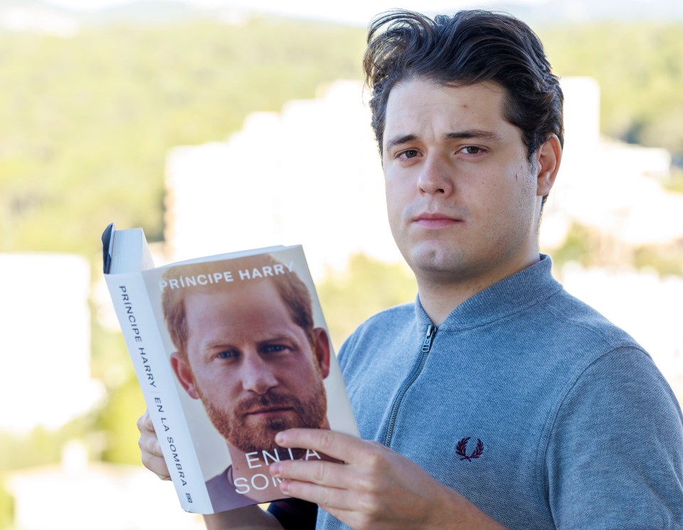 Sun reporter Amir Razavi with a copy of the Spanish version of Prince Harry's book