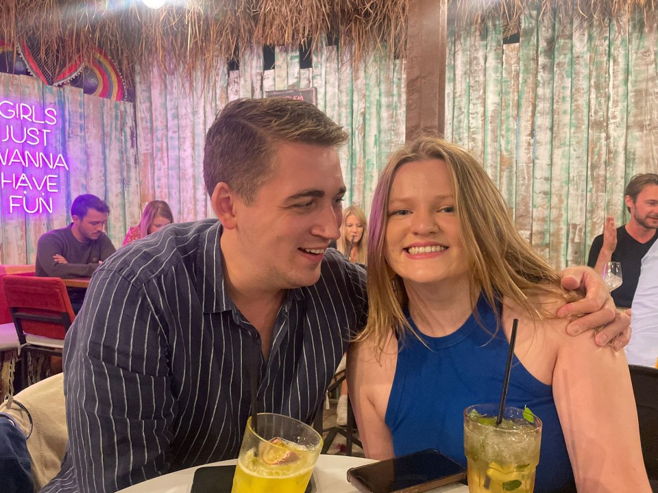 Lauren and Dylan relax at a beach bar