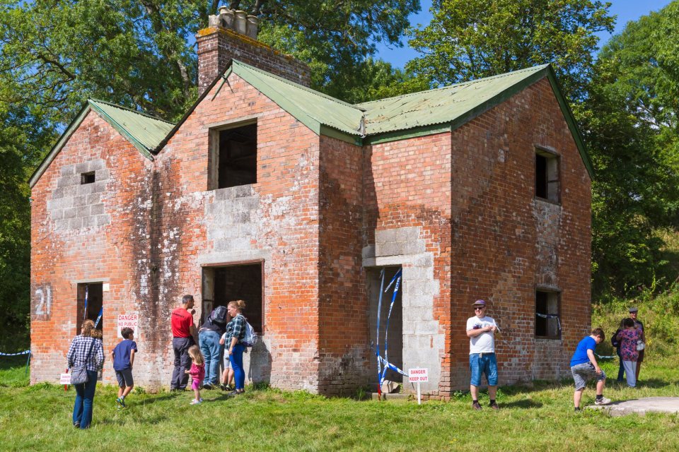 Abandoned houses stand in a once thriving village that now stands empty