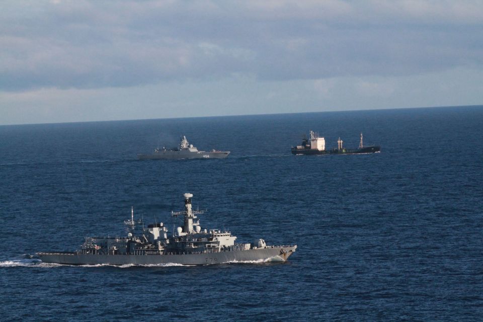 HMS Portland, front, shadows Admiral Gorshkov and her tanker Kama