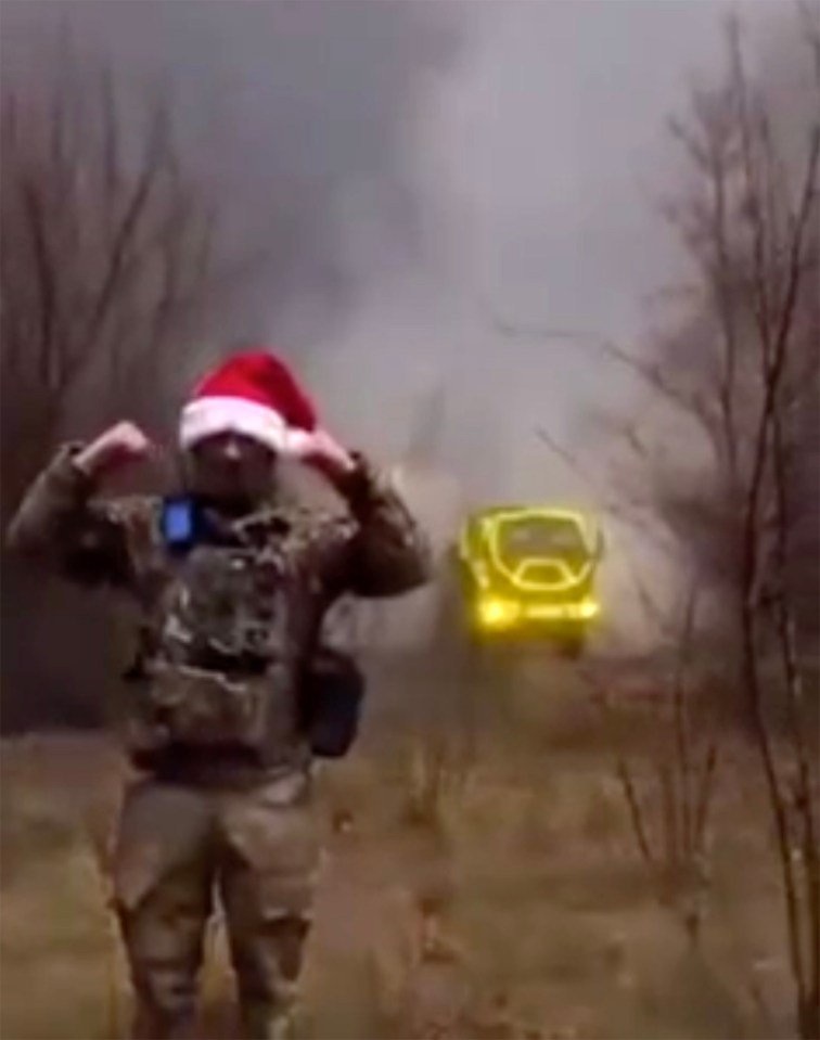 A Ukrainian soldier posed next to the missile that struck the barracks