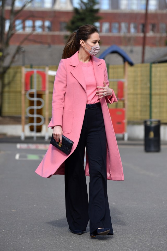 The then Duchess of Cambridge wore a pink coat, a colour that shows compassion and love, as she hit the headlines over relations with Meghan