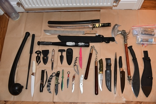 Dozens of weapons including machetes and Nunchucks and a Samurai