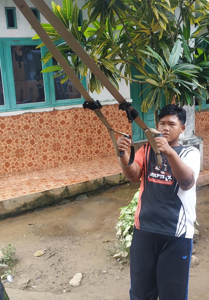 Aria working out at his home in West Java, Indonesia